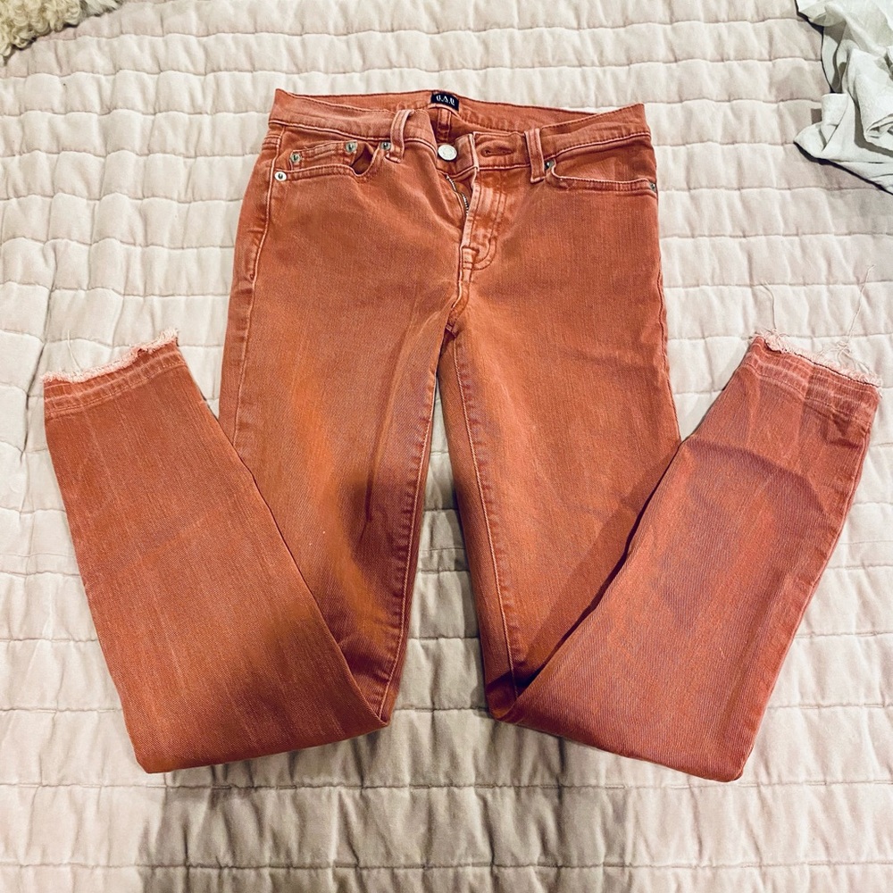 Muted red gap skinny jeans